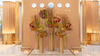 The Golden Ascent, a tall floral installation in Emirates First Class Lounge featuring Heliconia, Vanda orchids, spider chrysanthemums, and rosehips in golden and sunset tones, symbolizing Dubai’s ambition and luxury.