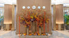 Indian Summer’s Rhapsody floral installation with autumn leaves, orchids, and pumpkins at Emirates First Class Lounge.