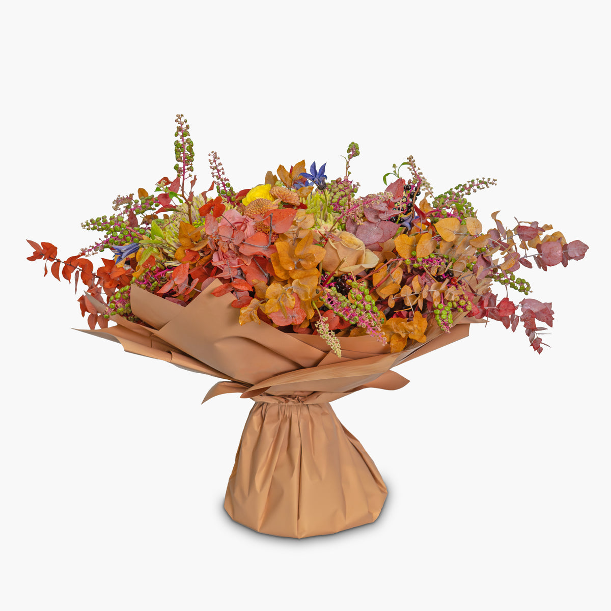 Bouquet of autumn flowers wrapped in brown paper on a white background