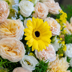 Bouquet of flowers with a yellow gerbera daisy in the center