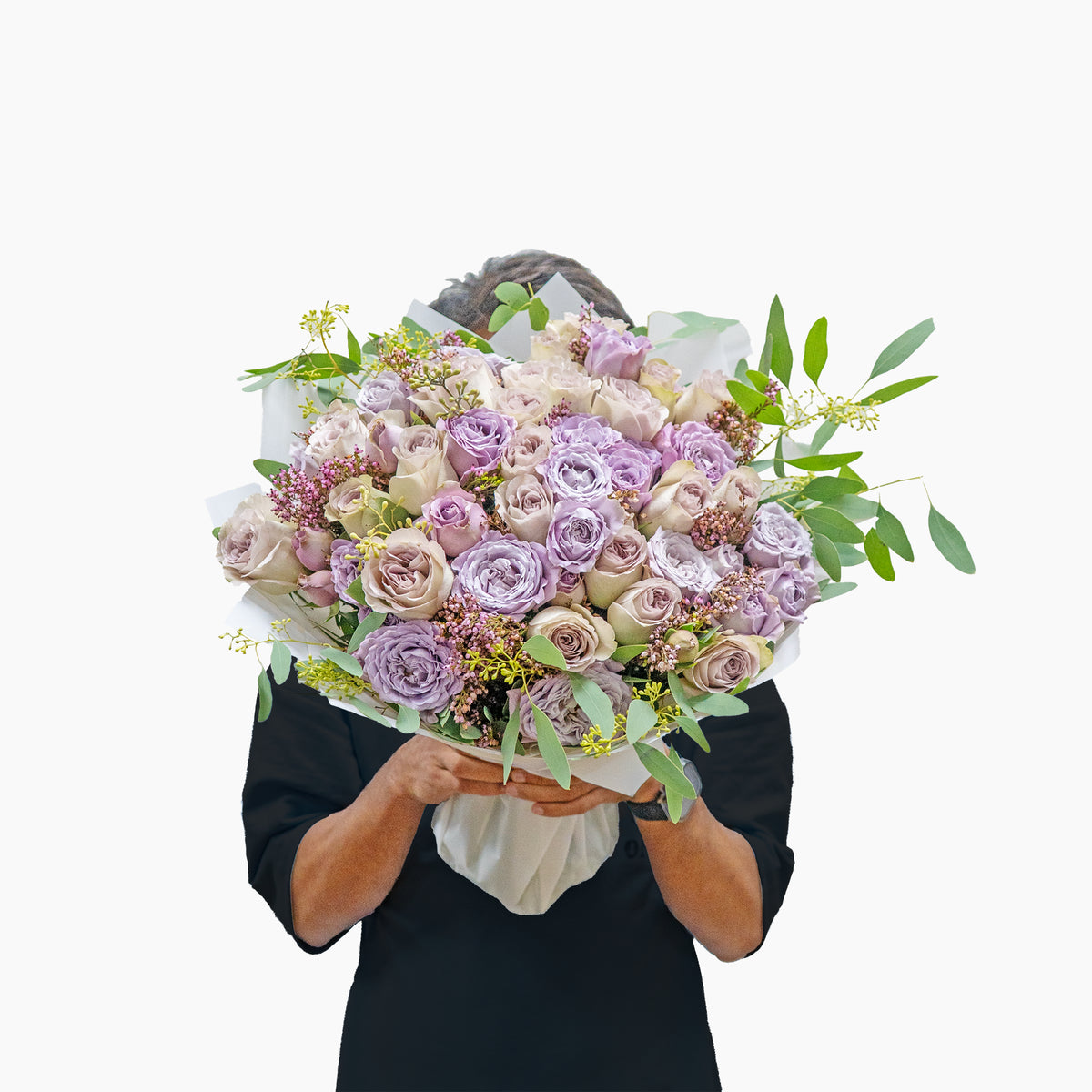 Person holding a bouquet of flowers on a white background