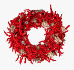Red decorative wreath with ornaments on a white background