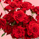 Detailed view of multiple red roses in Eternal Rose Basket, luxury roses arrangement for Valentine’s Day