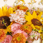 Bouquet of sunflowers and other flowers with a close-up view.