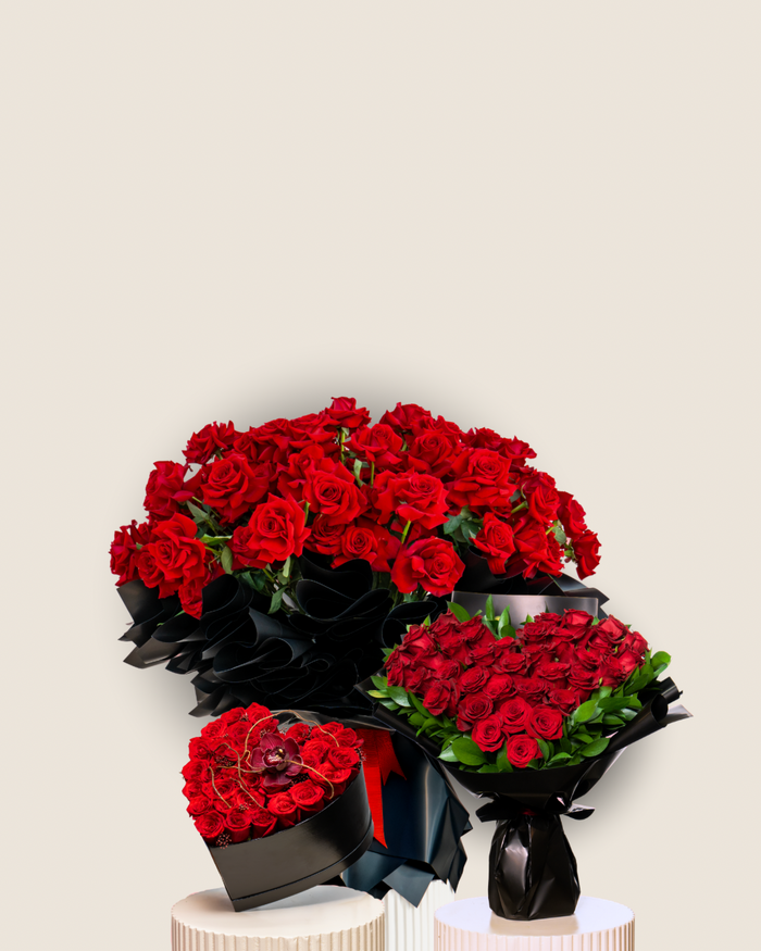 Bouquets of red roses with black ribbons on a beige background