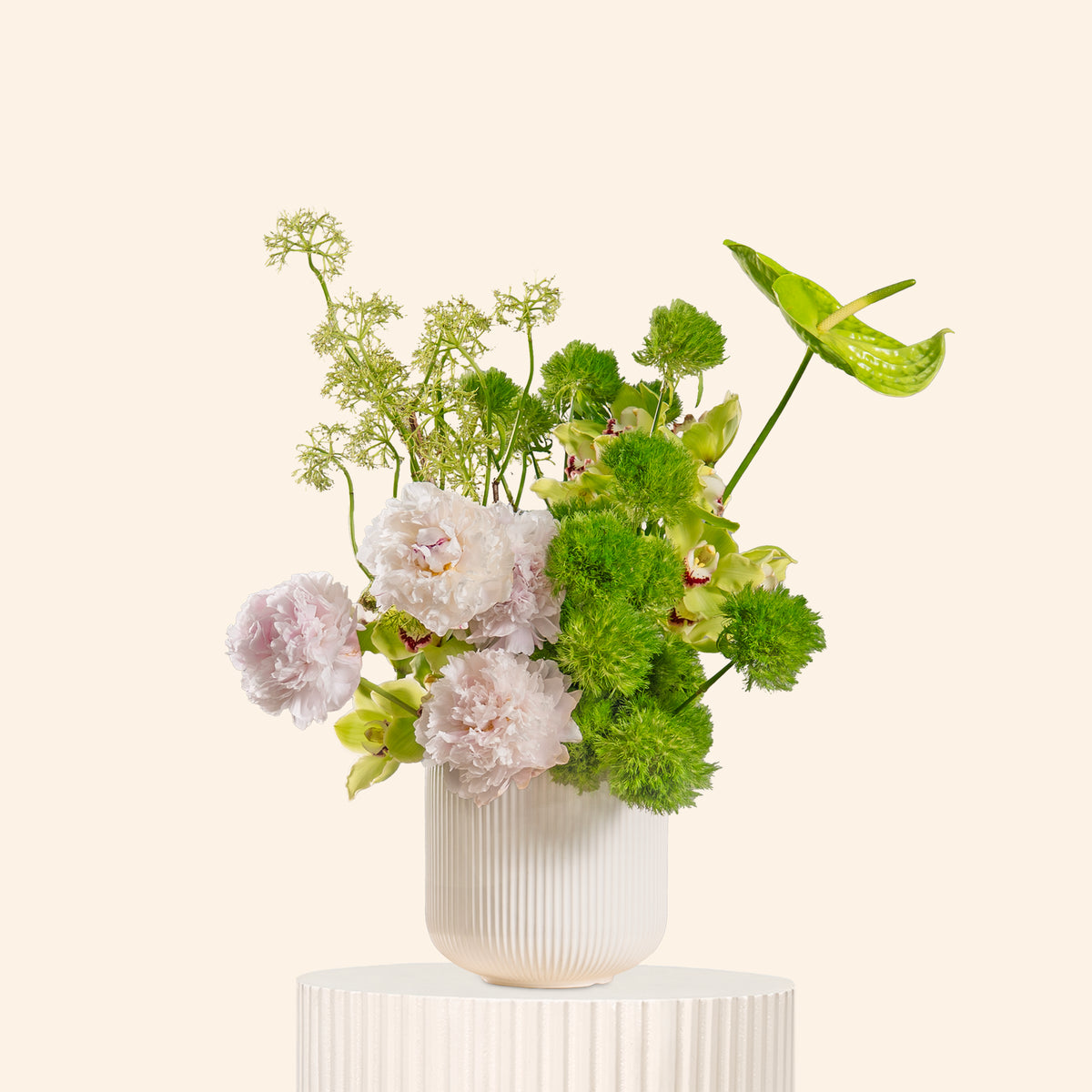 Floral arrangement in a white vase on a light background