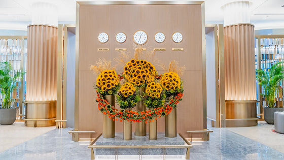 Sunflower installation titled The Solar Alliance at Emirates First Class Lounge, Dubai. A radiant circle of golden sunflowers 