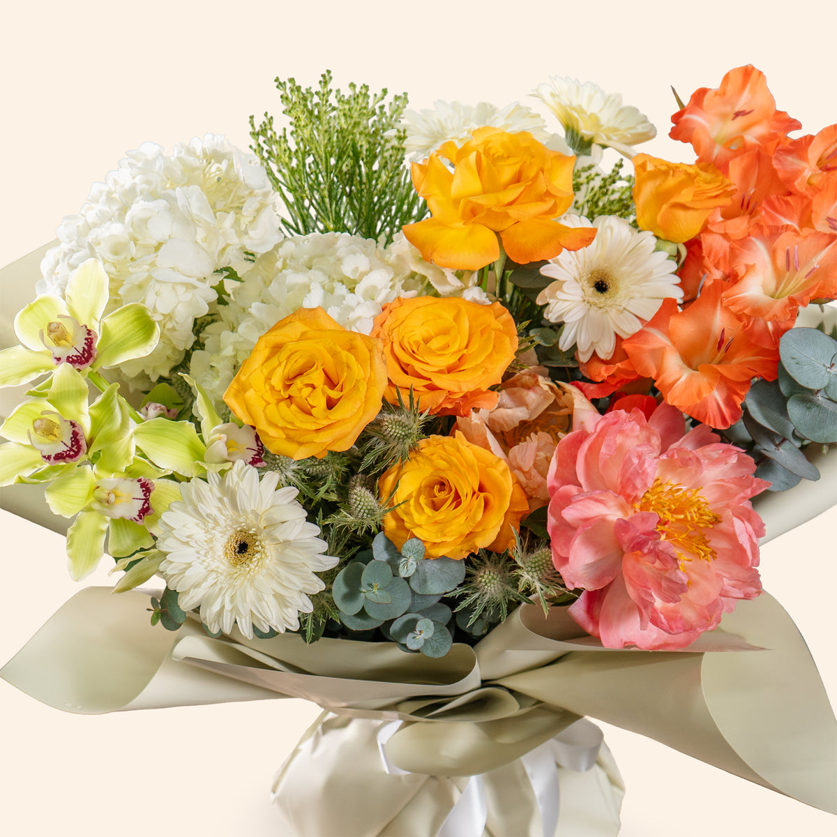 Bouquet of colorful flowers including roses and orchids on a light background
