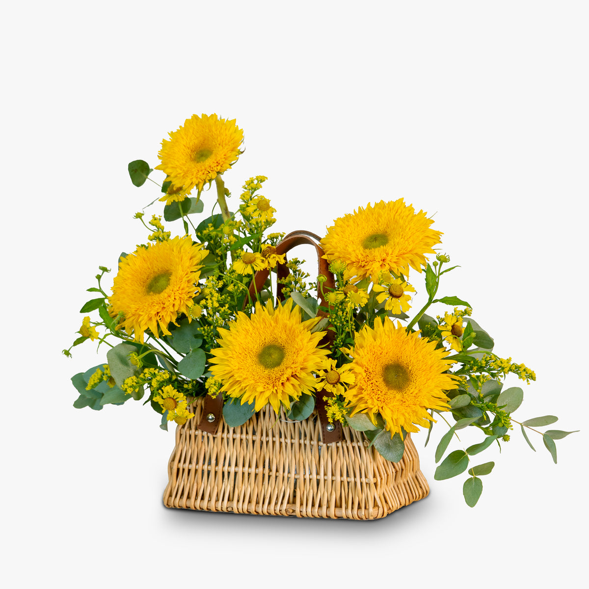 Basket of yellow sunflowers with greenery on a white background