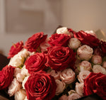 Bouquet of red and pink roses with a blurred background