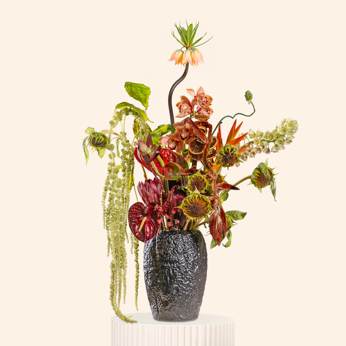 Vase with a colorful arrangement of flowers on a white background