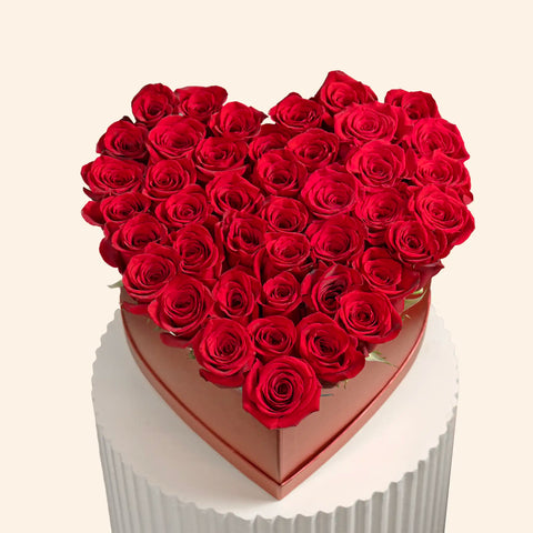 Red roses arranged in a heart shape