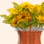 Basket of yellow sunflowers on a white background