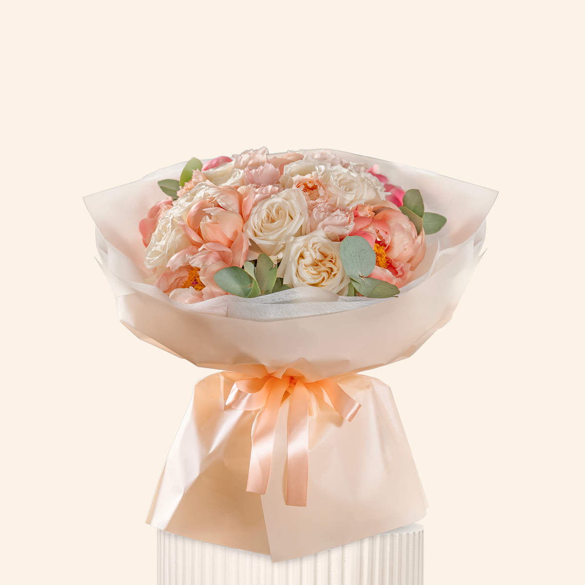 Bouquet of flowers with a white ribbon on a light beige background