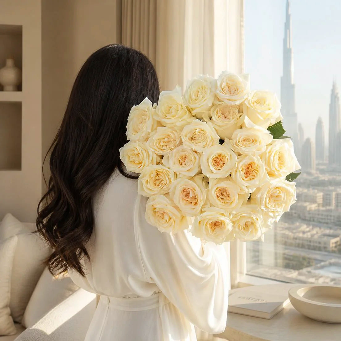 A warm-toned arrangement of cream and pink roses