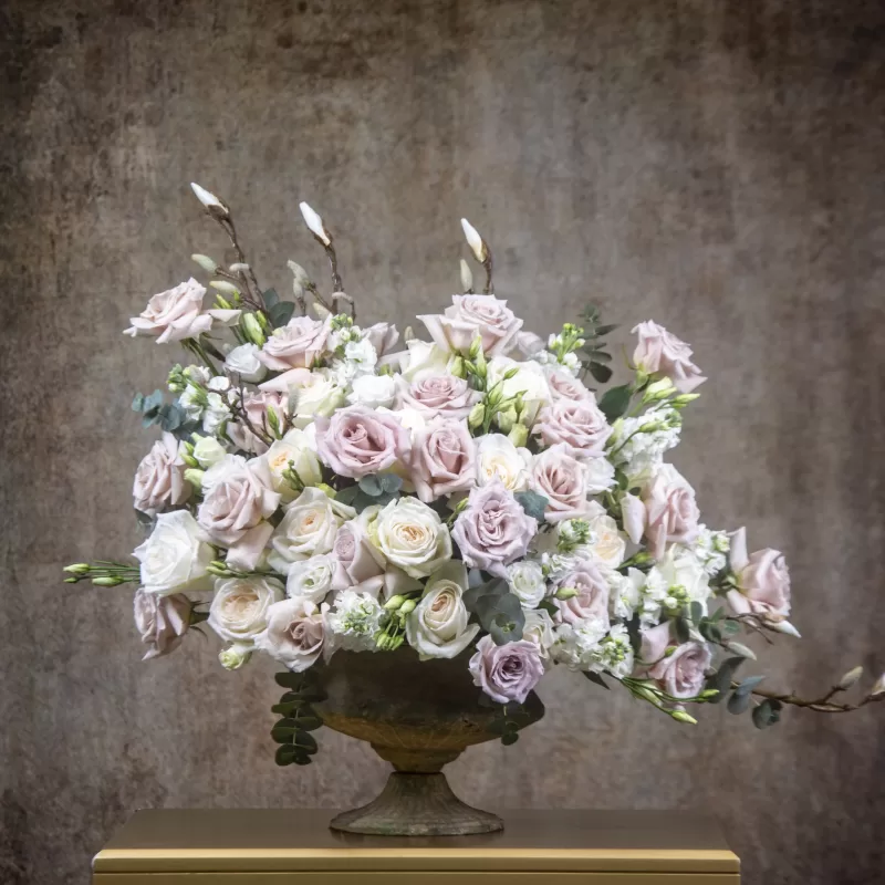 Serenity Flower Arrangement Quicksand roses White ohara roses White lisianthus White matthiola Eucalyptus touch Elegance and grace Soft hues Serene and tranquil Rustic-designed vase