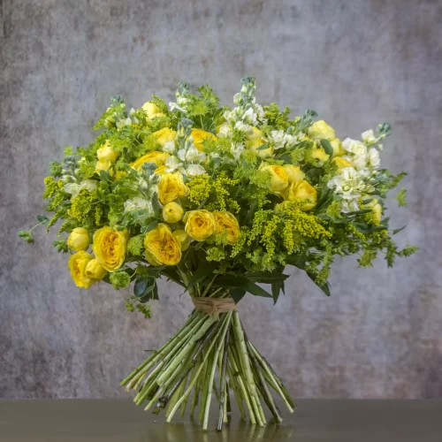 Golden Bliss Yellow bouquet Radiant joy Sunshine-inspired flowers Handcrafted beauty Captivating arrangement